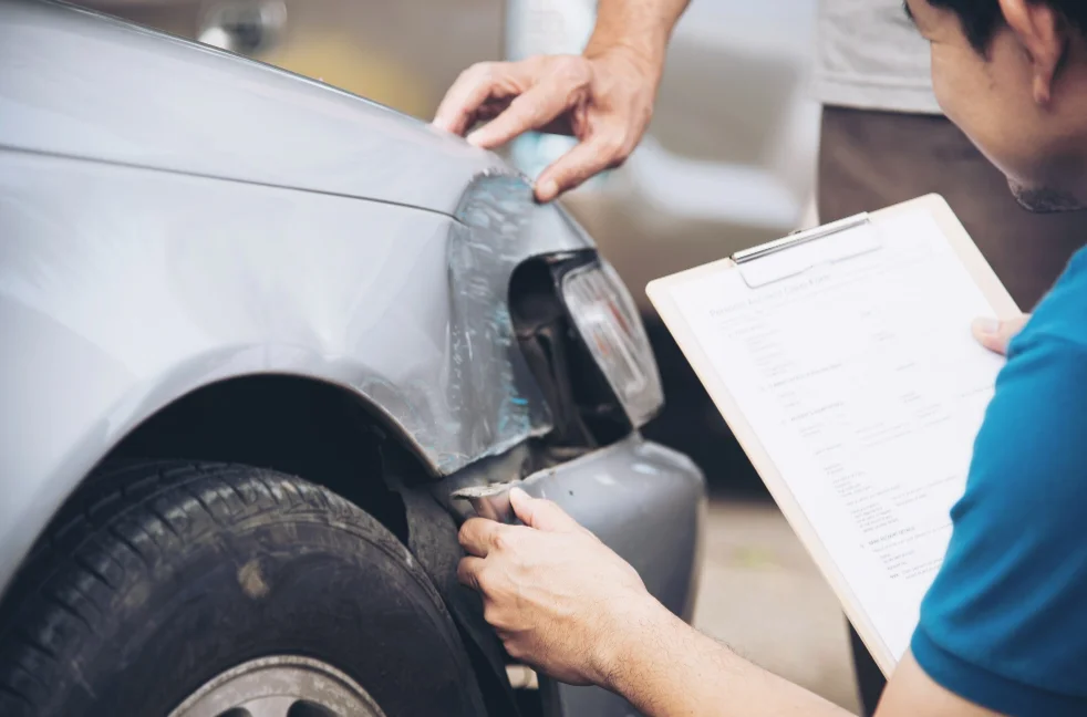 Insurance agent working during on site car accident