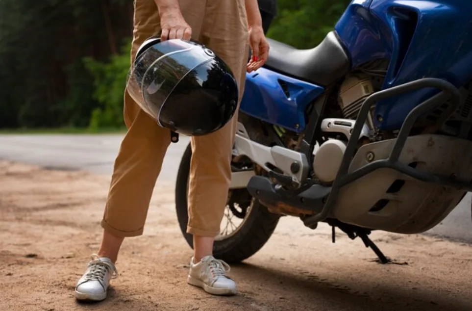 stylish rider checking wheel pressure