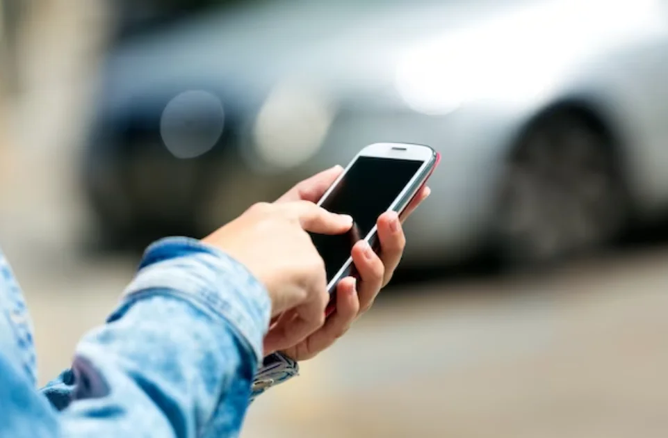 mobile phone in a woman's hand